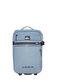 Light blue backpack with a padded design, featuring multiple zippered compartments, a top handle, and a black accent stripe across the front.