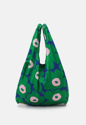 Genanvendelig stofnettaske med stort grønt og blåt blomsterprint og lyserøde blomstercentre, med et håndtagsdesign med løkke.