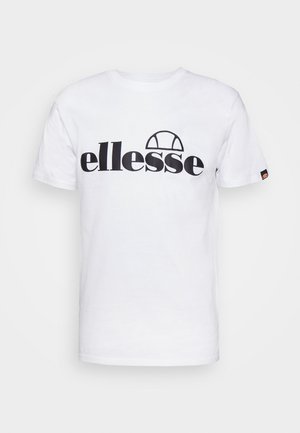 Bijela pamučna majica s velikim crnim "ellesse" logotipom i lukastim grafičkim dizajnom. Kratki rukavi s malim logotipom na lijevom rukavu.