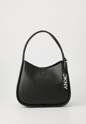 Black leather shoulder bag with a curved design, featuring a DKNY logo and a metallic tag. Smooth texture with a subtle grain finish.