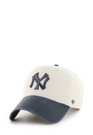 Baseball cap in light beige cotton with a dark navy curved visor. Features an embroidered NY logo in navy on the front.