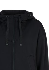 Zwarte zip-up hoodie met een trekkoordkap, textuurstof, zijzakken en een gladde afwerking met subtiele naaddetails.