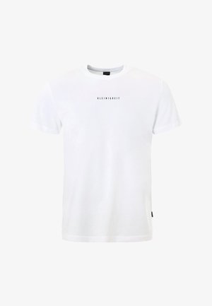 T-shirt blanc à manches courtes et col rond avec le mot « KLEINIGKEIT » imprimé en petites lettres noires au centre de la poitrine.