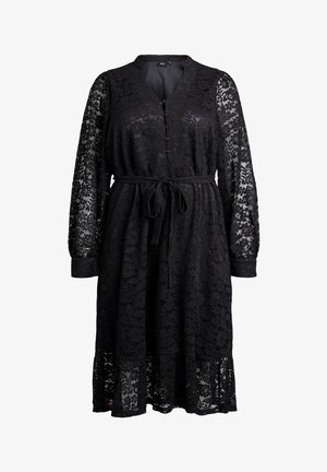 Mustat polvenmittaiset pitsimekot, joissa on pitkät puffihihat, napitettavat V-päät ja sidottava vyö.