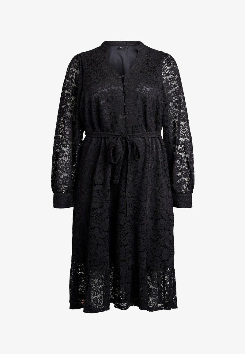 Abito in pizzo nero di lunghezza al ginocchio con lunghe maniche a sbuffo, scollatura a V con bottoni e cintura annodata in vita.