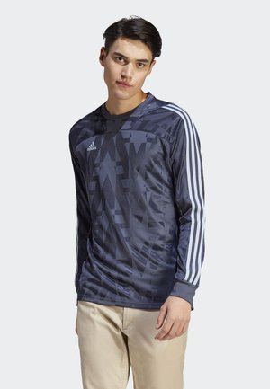 Donkerblauw, lang mouw sportshirt met een geometrisch patroon, met witte verticale strepen op de mouwen en een Adidas-logo op de borst.