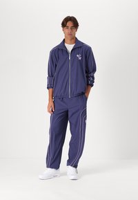 Love Scars COACH TRACKPANTS UNISEX - Παντελόνι - midnight purple