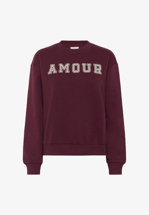 Bordeauxfarbenes Sweatshirt mit dem Wort "AMOUR" in cremefarbenem Druck. Mit gerippten Bündchen und Kragen sowie lockerer Passform. Aus weichem Baumwoll-Mix gefertigt.
