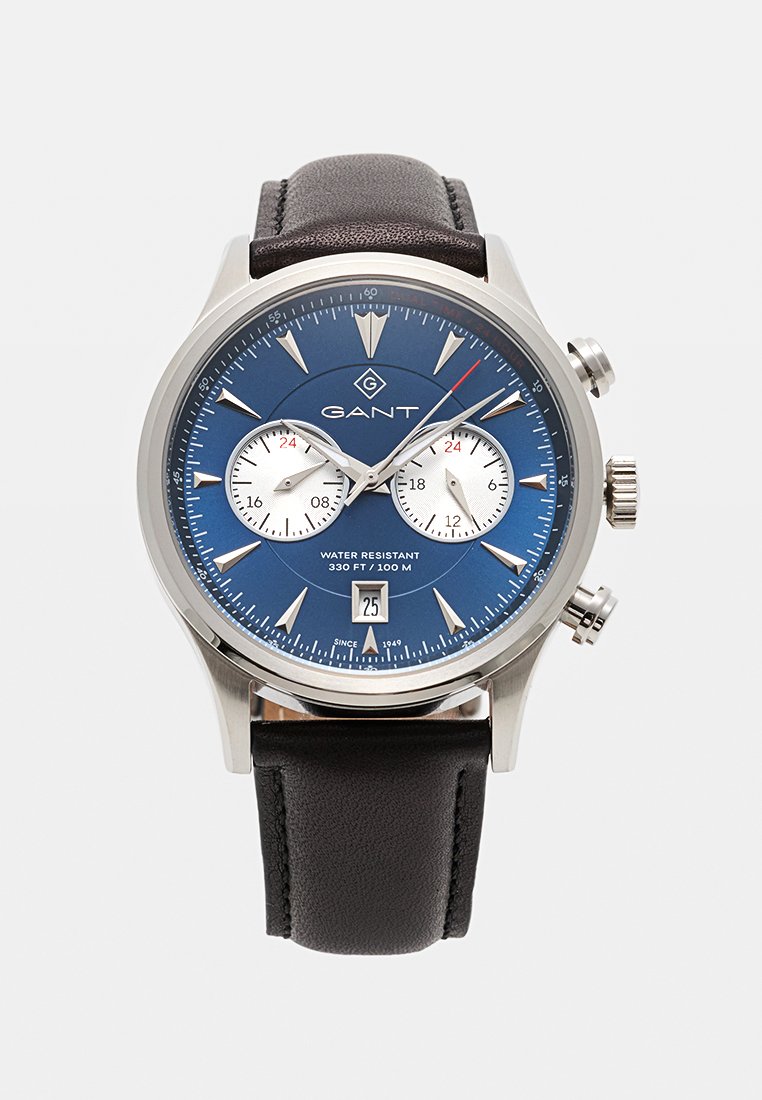 GANT armbandsur med blå urtavla, silvermarkörer, två vita subdials, datumfönster, silverboett och svart läderrem.