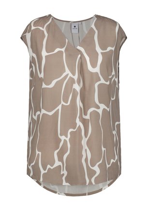 Beige blus med ett vitt abstrakt mönster, med V-ringning, korta ärmar och rundad nederkant. Tillverkad av lätt tyg.
