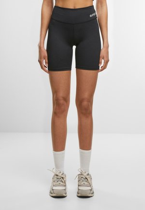 Sorte sportsshorts med høj talje, lavet af strækbart stof, med en glat overflade og et enkelt design.