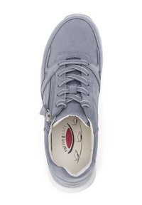 Gray suede sneaker with a rounded toe, textured surface, lace and zipper closures, and a cushioned interior featuring a logo.