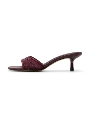 Burgundy open-toe mule with jeweled, lace-textured strap and low kitten heel on white background.