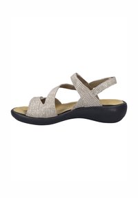 Beżowe sandały z krzyżującymi się paskami, z teksturowaną cholewką, odkrytymi palcami i wyściełaną wkładką, na niskim czarnym wedge.