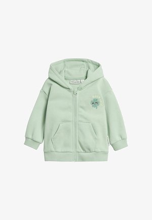Lichtgroene hoodie voor peuters met ritssluiting, voorzakken, capuchon, geribbelde manchetten en de tekst "Good Luck" met een klein, geborduurd groen figuurtje.