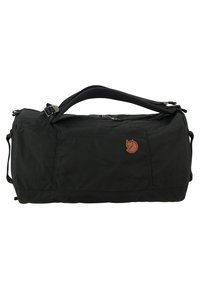 Sac de sport noir en tissu durable, doté d'un grand compartiment principal, de poignées robustes et d'un logo circulaire à l'avant.