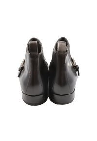 Stivali neri in pelle fino alla caviglia con una finitura liscia, dotati di un dettaglio con fibbia laterale e tacco basso. Vista posteriore che mette in evidenza la forma della punta rotonda.