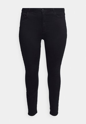 Black, stretchy skinny jeans with a smooth texture. Features include a button closure, belt loops, and four pockets. Fits snugly through the leg.