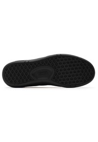 Black sneaker outsole with textured rubber surface featuring a diamond pattern for grip. Logo embedded near the heel. Smooth edges.