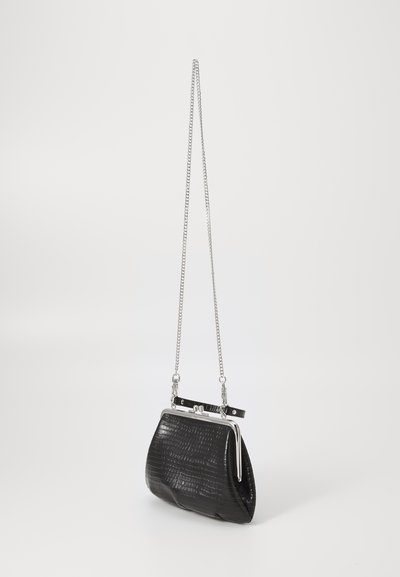 Black faux crocodile clutch bag with a curved shape, silver chain strap, and polished metallic hardware. Features a secure clasp closure.