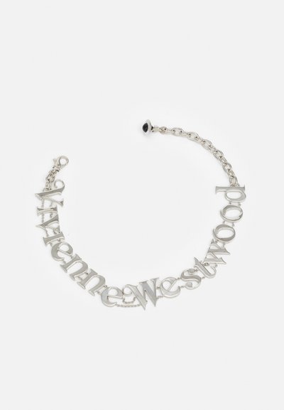 Silver chain bracelet featuring interlocking letters spelling "Vivienne Westwood." Glossy surface with a raised text design. Black accent at clasp.