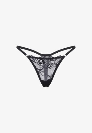 Tanga negro de encaje con bordes festoneados, patrón floral y paneles transparentes. Tirantes delgados que se conectan en la parte trasera, con una cinturilla lisa.