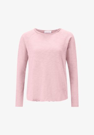 Langärmliges Oberteil aus weichem, strukturiertem hellrosa Stoff mit rundem Ausschnitt und Raglanärmeln; hat einen leicht abgerundeten Saum.