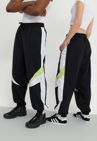 YOURTURN UNISEX - Jogginghose - black