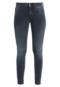 Jeans ajustados azul oscuro de mezclilla, con un diseño clásico de cinco bolsillos y un cierre con un solo botón en la cintura.