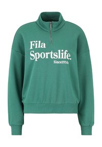 Felpa verde con un colletto alto, mezza cerniera e maniche lunghe. Presenta il testo bianco "Fila Sportslife" e il dettaglio "Dal 1974".