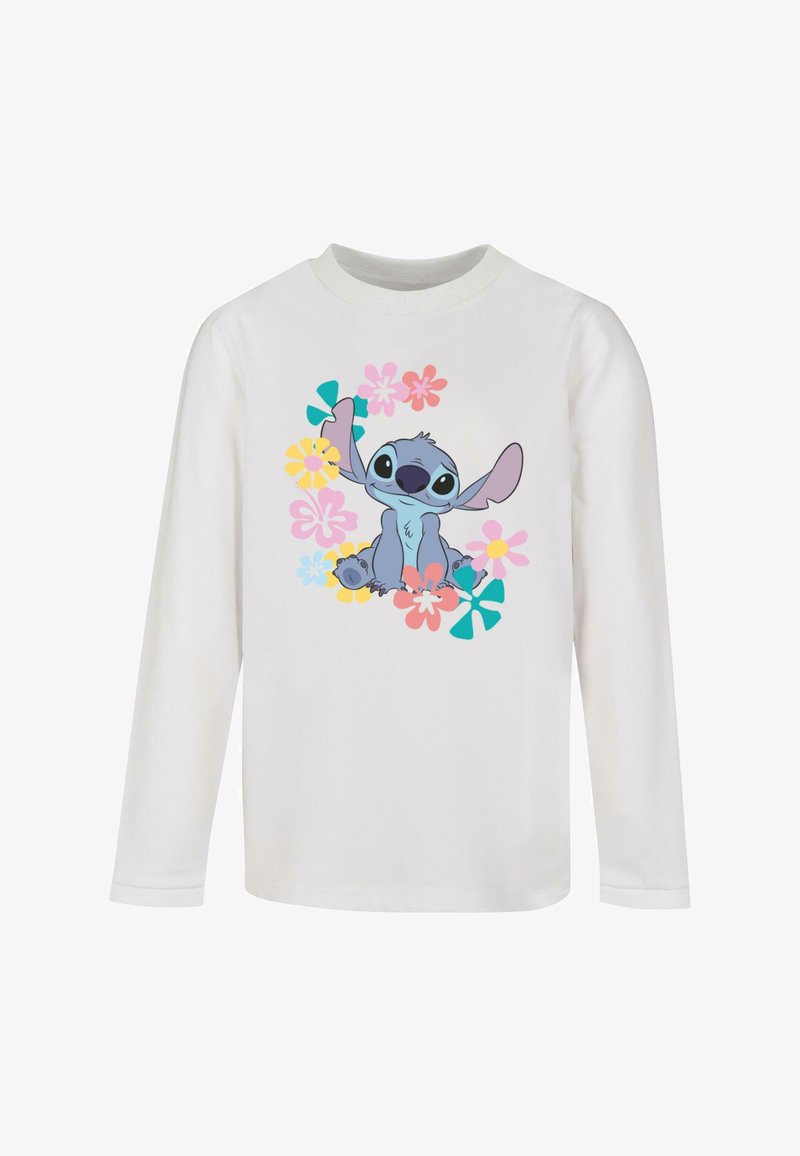 Pikad varrukatega valge T-särk, millel on koomiksitegelane ümbritsetud erksate lilledega roosa, kollase ja teali värvitoonides.