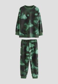 Ensemble de pyjama en camouflage vert comprenant un haut à manches longues avec des poignets côtelés et un pantalon assorti avec une taille élastique. Tissu doux au toucher.