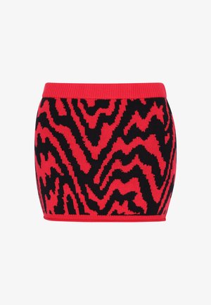 Dzianinowa spódnica mini z wzorem w zygzak w kolorze czerwonym i czarnym. Pas jest w jednolitym czerwonym kolorze, z teksturowanym wykończeniem na całej powierzchni.