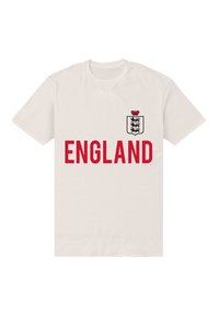 Biała bawełniana koszulka typu t-shirt z nadrukiem "ENGLAND" w kolorze czerwonym oraz małym herbem z koroną i trzema lwami w kolorach czarnym i czerwonym. Krótkie rękawy, okrągły dekolt.