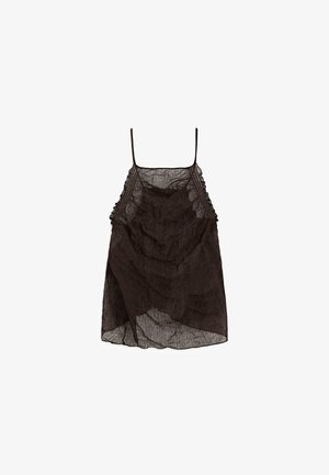 Svart, genomskinlig linne med volangstruktur och delikata axelband. Har intrikata detaljer längs halsringningen och nederkanten. Lättviktsmaterial.