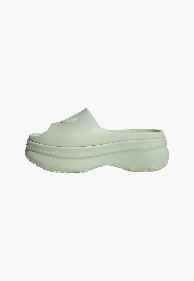 Light green slip-on clogs with a smooth texture, rounded design, and a thick, cushioned sole. Features a subtle logo detail on the front.