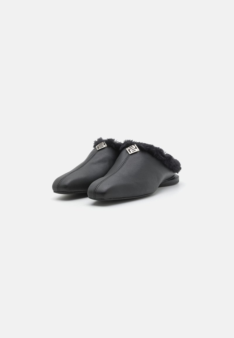 Black leather slippers with a plush black fur trim, pointed toe design, and silver hardware detail on the upper, offering a sleek appearance.