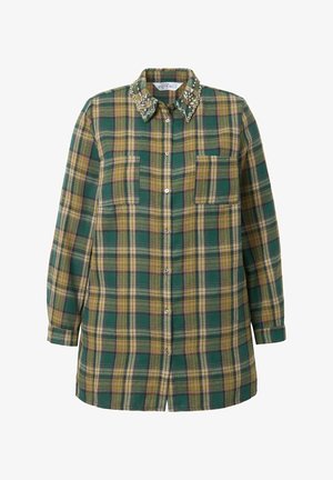 Kchecket flannel skjorte i grønne, gule og lilla nuancer. Har et udsmykket krave, to forlommer og knaplukning.