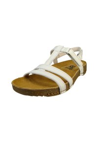 Hvide sandaler med en korksål, der har et remdesign og justerbare stropper. Sålen er struktureret for bedre greb.