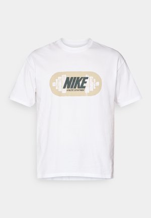 White cotton T-shirt featuring a center graphic with "NIKE" and "ATHLETIC DEPARTMENT" in dark green and beige, resembling a weight barbell design.