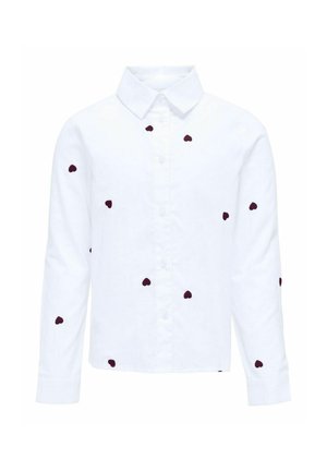 Camisa blanca de manga larga con botones, con pequeños patrones dispersos de corazones oscuros y cuello clásico, exhibida sobre un fondo liso.