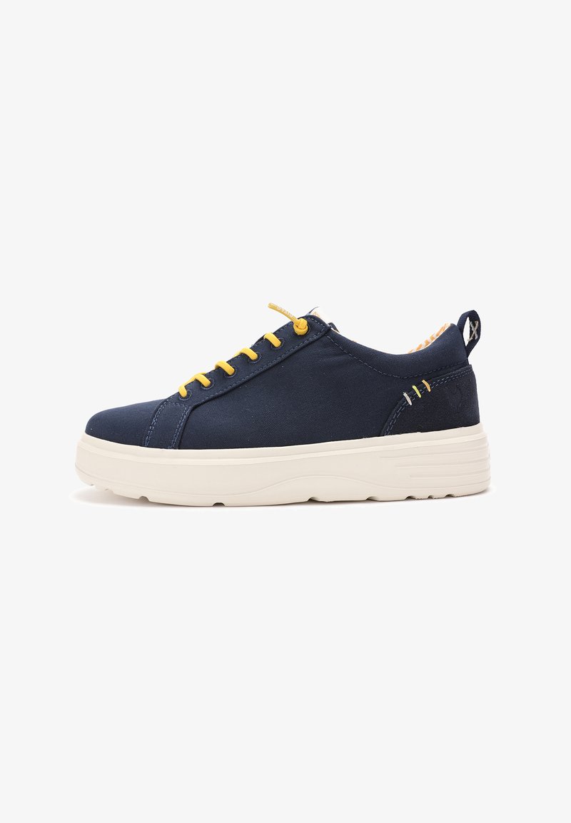Navy canvas sneakers with yellow laces and stitching, textured white rubber sole, and a patterned interior lining.