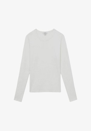 Pikad varrukad, pehmeast puuvillast valge t-särk, millel on ümar kaelus, mugav lõige ning puuduvad nähtavad mustrid või metalldetailid.