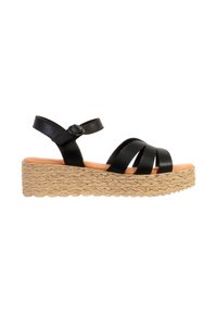 Sandale noire en cuir avec bride cheville, semelle plateforme en jute tressé et trois brides avant, fermeture à boucle sur fond blanc.