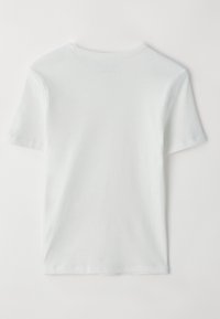 Lys grå crew neck t-skjorte laget av bomull. Korte ermer, ensfarget design og sømløs bak. Har en standard passform og en glatt tekstur.