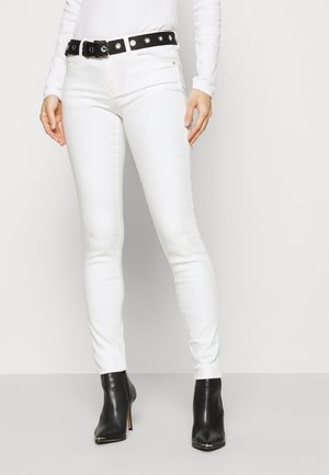 Vaqueros pitillo - white denim