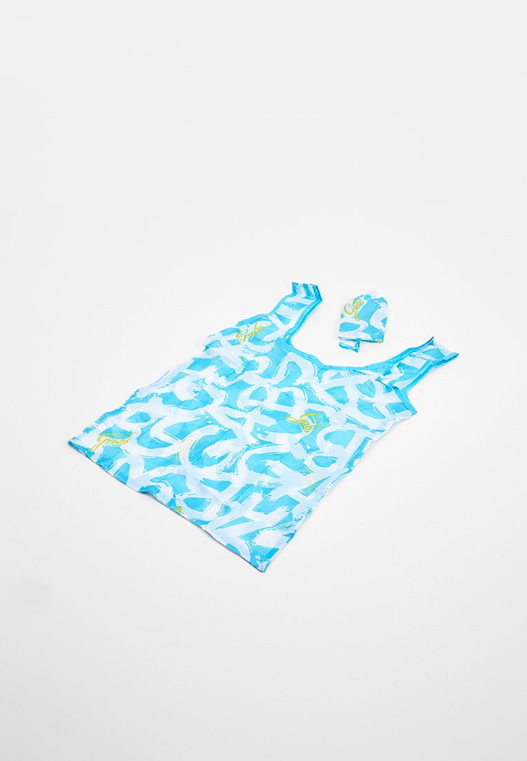 Borsa della spesa riutilizzabile con motivo astratto blu e bianco, completa di sacchetto abbinato, adagiata su uno sfondo bianco.