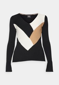 Top nero a maniche lunghe con scollo a V profondo, con un motivo geometrico a blocchi di colore bianco, nero e marrone. Tessuto a coste.