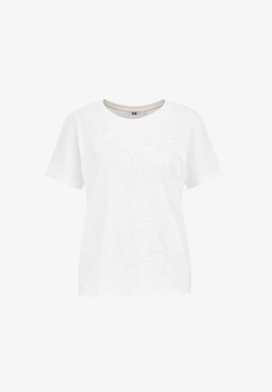 Balta medvilninė marškinėliai su iškiliu gėlių raštu, trumpomis rankovėmis ir apvaliu kaklu. Lygus paviršius su laisvu pritaikymu.