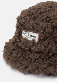 Brown bucket hat made of textured, curly fabric with a white label featuring "lollys laundry" and "Copenhagen."